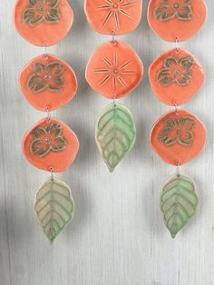 an assortment of orange and green ceramic ornaments