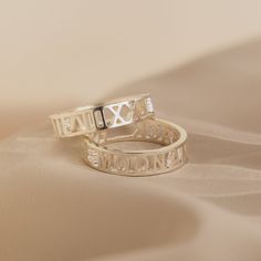 Cherish any meaningful date in your life with our intricate and unique Roman Numerals Ring. It's a great way of celebrating a deeply personal milestone through symbols that feel private to you. Material: High-Quality Solid 925 Sterling Silver Finish: Sterling Silver ∙ 18K Gold ∙ Rose Gold Dimension: 5mm height Personalized: This design can be customized with your Messages, Coordinates, Names, or Roman Numerals SKU: MM-RM03F30 Sizing Guide Rings are created true to standard US sizing. For the bes Luxury Minimalist Personalized Engraved Ring, Rose Gold Jewelry With Initials For Promise, Rose Gold Promise Jewelry With Initials, Rose Gold Initial Ring With Round Band For Anniversary, Symbolic Adjustable Stackable Rings For Anniversary, Symbolic Stackable Open Rings For Anniversary, Elegant Adjustable Engraved Ring For Mother's Day, Rose Gold Initial Ring For Anniversary, Timeless Hallmarked Engraved Promise Ring