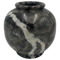 a black and white marbled vase on a white background