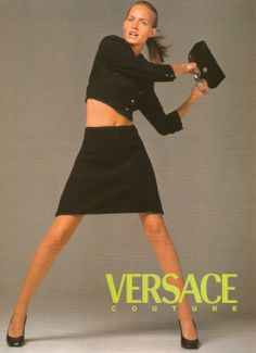 a woman in a black dress and heels posing for versa magazine