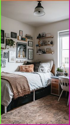 a bed sitting in a bedroom next to a window with pictures on the wall above it