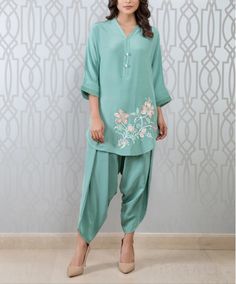 Stylish semi formal party wear Pakistani short tunic with dhoti salwar This super trendy pistachio green short tunic has beautiful floral resham thread embroidery. It has matching dhoti salwar to complete the look. ✨We stitched outfit with lot of care, so that our customers should not have any issues regarding finishing and fitting. 🌸All the dress are hand wash and do not use any harsh detergent. To make your outfit long lasting use fabric conditioner after wash. Spring Tunic Sets With Resham Embroidery, Spring Sets With Resham Embroidery Tunic, Summer Pista Green Kurta With Floral Embroidery, Semi-stitched Pista Green Palazzo Set For Spring, Festive Green Tunic With Resham Embroidery, Anarkali Tunic With Resham Embroidery For Summer, Summer Anarkali Tunic With Resham Embroidery, Spring Pista Green Salwar Kameez With Resham Embroidery, Pista Green Salwar Kameez With Resham Embroidery For Spring