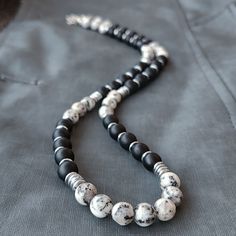 If you are looking for the 8mm Black Onyx and Quartz and Hematite Beaded Necklace, this necklace is for you! If you are looking for a gift necklace for your boyfriend, brother, father or husband, this necklace is for you! Quartz Choker Necklace for Men; - 8mm Matte Onyx beads. - 8mm Gray Patterned Quartz beads. - 6mm Hematite. - Silver color lobster clasp. - Choker Necklace is made of Stainless Steel Wire. -The necklace length you see in the pictures is 16 inches. - Necklace length 14" to 32"+ 1 Men Beaded Necklace Ideas, Mens Beaded Necklace, Mens Mala Necklace, Mens Necklaces, Quartz Choker, Mens Beaded Necklaces, Necklaces For Men, Gemstone Necklaces, Necklace Men