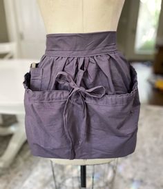 a mannequin with a purple skirt on it