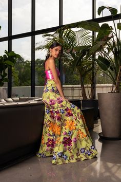 model leaning against a dark leather sofa in a high waisted lime green, floral sequin gabriella lehenga skirt. Styled with a neon iridescent pink sequin bralette top with a lace-up back. Asian Wedding Outfits, Sequin Lehenga, Lehenga Skirt, Bralette Top, Pop Style, South Asian Wedding, Green Sequins, 12 Weeks, South Asian