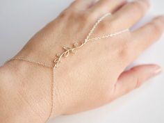 "This Original Oriental Hand Jewelry is made with Sterling Silver chains, and one Sterling Silver Branch adorned with leafs, and spirals ➵ Perfect to wear alone or for layering with more bracelets. ➵ The bracelet length is ajustable thanks to 5 cm (2 in) extender chain. Perfect for Bridesmaid, Oriental Wedding, Parties,... --*--*--*--*--*--*--*--*--*--*--*--*--*--*--*--*--*--*-- ∞ SIZE ∞ - Bracelet length: Adjustable bracelet - around 17 cm (6,7 in) - 22 cm (8,7 in). If you like another length p Silver Hand Wrapped Minimalist Bracelet, Elegant Leaf-shaped Wedding Jewelry, Handmade Leaf-shaped Wedding Jewelry, Hand-strung Dainty Sterling Silver Bracelets, Elegant Adjustable Leaf-shaped Jewelry, Adjustable Hand-strung Silver Braided Bracelet, Bohemian Sterling Silver Bracelet Hand-strung As Gift, Silver Leaf Bracelet, Bullet Earrings