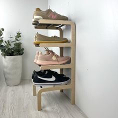 Tired of shoes spilling out all over your floor? This wood and metal shoe rack for entryway can help. Instantly create more space with its 4 tier of shoe storage, so you'll never trip over a rogue sneaker again! So take the hassle out of shoe storage, and say hello to effortless organization. DIMENSIONS: 4 tier shoe stand will work for 5 pairs of shoes Height: 24 inches (61 cm) Length: 11 inches (28 cm) Depth: 11 inches (28 cm) Distance between tiers: 6 inches (15 cm) PRODUCT MATERIAL: - Birch p Small Vertical Shoe Rack, Wall Mounted Shoe Organizer, Wall Shoe Storage, Spinning Shoe Rack, Small Shoe Rack, Vertical Shoe Rack, Quirky Shoes, Shoe Stand, Shoes Organizer