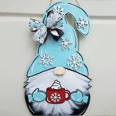 a door hanger decorated with an image of a bunny holding a coffee cup