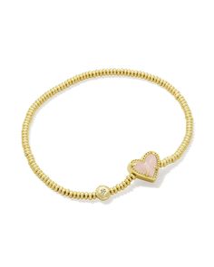 An easy addition to any wrist stack, meet the Ari Heart Gold Stretch Bracelet in Rose Quartz. Our iconic sweet heart shape meets the versatile stretch bracelet style, perfect for adding a casual but cute pop of color to your look. The best part? It’s designed to fit any wrist. Metal 14k Yellow Gold Over Brass Material Rose Quartz Closure Stretch Bracelet Size 6.5" Unstretched Circumference, 0.43"L X 0.37"W StationDue to the one-of-a-kind nature of the medium, exact colors and patterns may vary slightly from the image shown. | Kendra Scott Ari Heart Gold Stretch Bracelet in Rose | Quartz Kendra Scott Heart Bracelet, Kendra Bracelet, Friend Ship Bracelets, Little Words Project Bracelets, Kendra Scott Rose Quartz, Wrist Stack, Gold Stretch Bracelet, Kendra Scott Bracelet, Bday Gifts