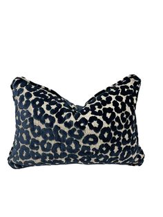 a leopard print pillow on a white background