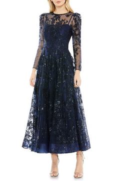 A deeply charming cocktail dress is tumbled in tonal embroidered blooms and cut from frothy, sheer tulle. 48" length Jewel neck Long sleeves Lined 100% polyester Spot clean Imported Asian Owned/Founded Sheer Embroidered Dress, High Neck Gown, Floral Evening Dresses, Lace A Line Dress, Tulle Midi Dress, A Line Cocktail Dress, Long Sleeve Sheath Dress, Mac Duggal Dresses, Mob Dresses