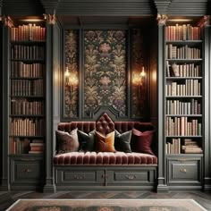 a room with bookshelves filled with lots of books and pillows on top of it