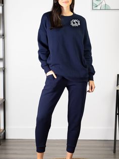 Don't sweat the small stuff in life. Live in comfort and enjoy the journey in this sweatshirt and pant set. It will be the first thing you put on when you walk in the door every day! Features a solid ribbed hem, soft fleece lining, large pockets, drawstring pants. Navy Set - Model is wearing a size M. 53% Cotton, 45% Polyester, 2% Spandex. Size Chart Relaxed Fit Fleece Sweats For Loungewear, Fleece Sweats With Elastic Cuffs For Loungewear, Comfy Fleece Sweats For Lounging, Fleece Sweatpants With Letter Print For Loungewear, Comfy Fleece Sweats For Loungewear, Navy Long Sleeve Tracksuit In Athleisure Style, Comfy Fleece Activewear For Loungewear, Fleece Sweats For Lounging In Athleisure Style, Navy Long Sleeve Tracksuit Athleisure