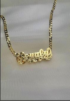 *Beautiful necklace Made in either 10k or 14k real solid gold, our double nameplates are personalized and made to order. Cuban link chain is 100% solid 10k or 14k gold heavyweight necklace. *Cuban link necklace weight approximately: 6-10 grams *Double name charm size approximately: 1.5"x1/5"inches (7 LETTERS MAX) -how to order: Select: DOUBLE NAME CHARM ONLY OR WITH 3MM NECKLACE SIZE. *3mm necklace size available: 14in,16in,18in,20in,22in,24inches. *Shipping:2-4 days  *Labor:1-5 days -Note: up t Silver Name Plate Necklace, Customizable 14k Gold Pendant Necklace, Personalized Gold Necklace For Anniversary, Personalized Gold Necklace For Anniversary Gift, Customizable 14k Gold Nameplate Jewelry, Pendant Name Necklace For Anniversary Gift, Custom Name 14k Gold Jewelry, Customizable Yellow Gold Nameplate Jewelry, Custom Name Gold Necklace With Heart Pendant