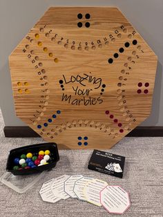 a wooden board game set up with matching cards