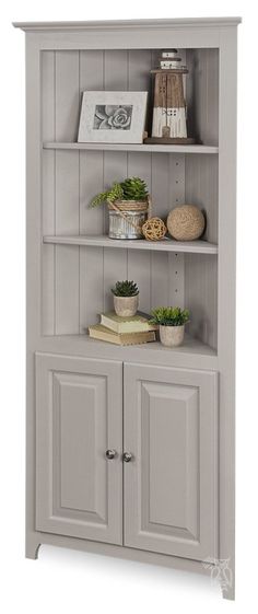 an open bookcase with two doors and shelves on top of each shelf is shown