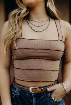 A summer sellout. This tank is a must have in your closet! #summer #summerstyle #chicboutique #cowgirlstyle #westernfashion #western #cowgirlstyle Summer Layering Tank Strap Crop Top, Cropped Tank Top For Layering, Summer Cropped Tank Top For Layering, Cropped Tank Top For Summer Layering, Spring Crop Top With Tank Straps For Layering, Casual Tank Crop Top For Layering, Trendy Cropped Tank Top For Layering, Brown Cropped Cotton Tank Top, Cropped Brown Cotton Tank Top