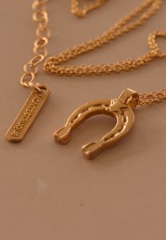 ” The combination of luck and magic, captured by this symbol is believed to bring good luck and fortune in people’s lives.” Handcrafted etched horseshoe pendant. 14K gold-filled chain/bronze pendant, sterling silver chain/fine silver pendant Standard Adjustable 16” + 2” Handcrafted in Los Angeles Lucky Charm Necklace, Horseshoe Pendant, Dragonfly Charm, Gold Charm Necklace, Bring Good Luck, Bronze Pendant, Initial Pendant, Bags And Shoes, Single Earring