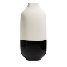 a black and white vase sitting on top of a table