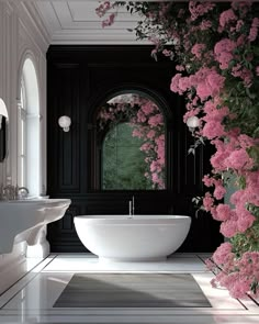 a bath tub sitting next to a window with pink flowers growing on it's side