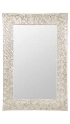 a white square mirror with an animal skin pattern on it's edge and a silver frame