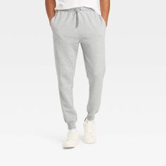 From spending a leisurely weekend to running errands, take on your day in comfy style in these Tapered Fleece Jogger Pants from Goodfellow & Co™. Made from cotton-blend fleece fabric for cozy comfort, these mid-rise tapered joggers feature a drawstring elastic waistband to help you find a secure fit, while the cuffed design offers a snug fit. Plus, they're designed with side and back pockets to carry your essentials as you go about your day. Goodfellow & Co™: Feel good in what you wear, anywhere Tapered Joggers, Cargo Joggers, Fabric Tape, Comfy Fashion, Mens Fleece, Fleece Joggers, Cotton Fleece, Bottom Clothes, Jogger Pants