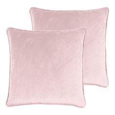 two pink velvet pillows on white background