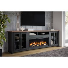 an entertainment center with a fireplace in the middle