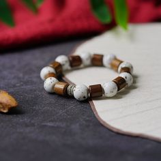 Material: Ceramic Fashion Element: Auspicious Pattern Style: Ethnic Style Handmade Wooden Beaded Bracelets For Meditation, Traditional Wooden Bracelets With Round Beads, Traditional Wood Bracelets With Round Beads, Traditional Wooden Bracelet With Round Beads, Handmade Wooden Jewelry For Meditation, Traditional Wooden Bracelets As A Gift, Traditional Wooden Bracelet As Gift, Wooden Beaded Bracelets Perfect For Gifts, Bohemian Wood Bracelet Jewelry