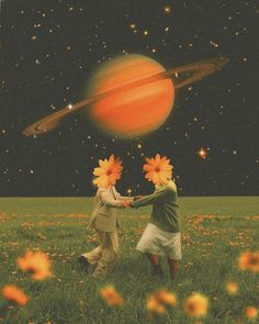 two people holding hands in the middle of a field with flowers and planets above them