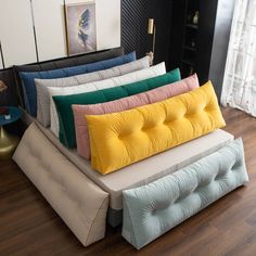 a bunch of pillows stacked on top of each other