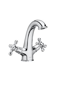 a chrome faucet with two handles and three spouting holes on the side