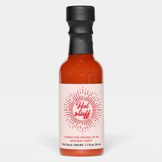 a bottle of hot sauce on a white background