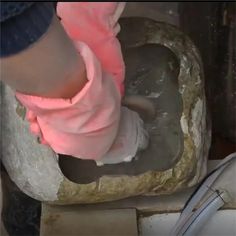 a person is working on a piece of pottery