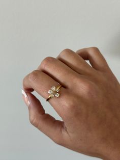 Flower ring - This adjustable dainty flower ring is incredibly stunning. Made to sparkle and shine on any finger! A perfect gift for women, girlfriend, best friends, sisters, moms. A perfect option for those who like minimal dainty gold rings and want to have the perfect size. - gold filled - stainless steel and gold - cz stones - minimalist - adjustable WHY VASI Jewelry? - Ethically sourced gems and stones - Made with recycled gold - Handmade or designed/sourced - Shop local (based in Chicago) Rose Gold Ring For Spring, Spring Rose Gold Ring Jewelry, Dainty Adjustable Butterfly Promise Ring, Rose Gold Jewelry For Anniversary In Spring, Rose Gold Jewelry For Spring Anniversary, Delicate Adjustable Butterfly Promise Ring, Spring Wedding Jewelry In Flower Shape, Dainty Open Butterfly Ring For Promise, Delicate Jewelry For Anniversary In Spring