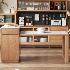 a woman standing in front of a kitchen counter