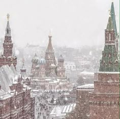 an image of a snowy cityscape that looks like it is in the middle of winter