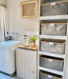 the laundry room is clean and ready to be used as a storage area for clothes