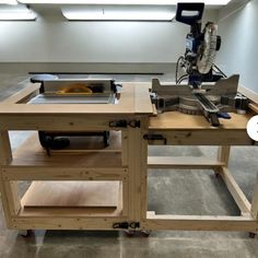 a workbench with a table sawing machine on it's centerpiece