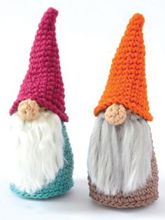 two crocheted gnomes sitting next to each other