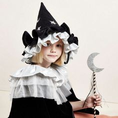 This witch's hat, with ruffle details, is very stylish indeed. It is crafted from black velvet, with silver lamé and silver glitter stars and moons. An essential accessory for Halloween, or to add to a dressing up box for imaginative play any time of the year. The hat is made from soft black velvet It has ruffle details on the brim made from black velvet and shiny silver lamé Silver glitter stars and moons add a delightful embellishment It has a fabric lining to give shape and support The black Witchy Winter Party Costume Hats And Headpieces, Witchy Winter Hats For Party, Witchy Costume Accessories For Carnival Party, Adjustable Silver Costume Hats And Headpieces, Childrens Halloween Costumes, Pierrot Clown, Creepy Costumes, Black Witch Hat, Stars And Moons