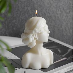 a candle that is sitting on top of a book