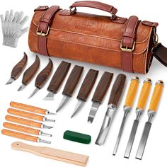 an assortment of tools are laid out on a white surface, including a leather case