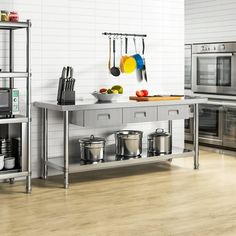 an industrial style kitchen with stainless steel appliances