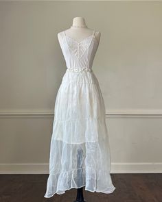 - Fairy crinkled maxi dress featuring sheer mesh outer layer with satin white lined skirt- elastic waist; fairycore ; ethereal aesthetic- size S-M- lovely condition with no visible flaws  🤍 Size of mannequin: size 2 - 4 Gothic White Dress, White Fairycore Costume Dress, Sheer White Dress Aesthetic, White Fairy Dress For Summer Dress-up, White Sleeveless Fairy Dress For Dress-up, White Fariy Dress, White Sheer Coquette Dresses, White Dress Aesthetic, Horror Clothes