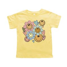 Looking for a cute tee for your kids? We have the perfect Flower Smiley Face graphic tee addition to their closet! Also available in youth tees. Playful Smiley Face Tops For Spring, Cute Spring Tops With Smiley Face, Cute Smiley Face Tops For Spring, Cute Smiley Face Top For Spring, Playful Screen Print Tops For Spring, Playful Spring Screen Print Tops, Short Sleeve Tops With Smiley Face For Spring, Spring Tops With Smiley Face, Short Sleeve, Spring Smiley Face Short Sleeve T-shirt