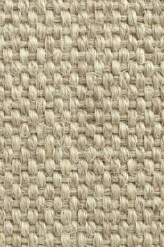 an up close shot of the texture of a woven fabric with white and beige colors