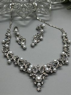 Pearl Crystal Rhinestone Necklace Earrings Set Lobster Claps Elegant Bridal Formal Shower Party Event Accessories New Comes in Gift Box as Shown Metal Rhinestone Necklace For Wedding Costume Jewelry, Metal Rhinestone Necklace For Weddings, Costume Jewelry Style, Costume Jewelry Rhinestone Necklace For Wedding, Costume Jewelry Metal Rhinestone Necklace For Wedding, Metal Rhinestone Costume Necklace For Weddings, Alloy Rhinestone Necklace For Wedding, Wedding Rhinestone Metal Jewelry Sets, Rhinestone Metal Jewelry Sets For Weddings, Silver Alloy Bridal Necklace For Party