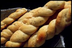 some kind of bread sitting on top of a black plate