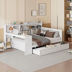 a living room with a bed, couch and bookshelf